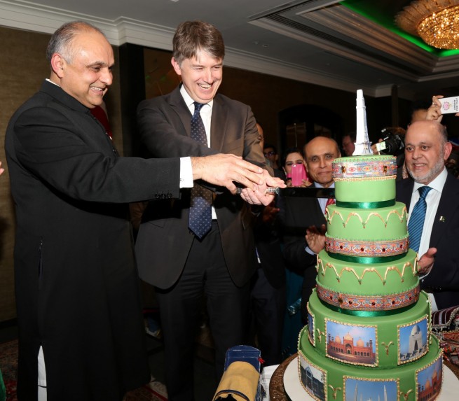 Syed Ibne Abbas, Pakistan High Commissioner to the UK and Mr Owen Jenkins, Prime Minister's Special Representative on Afghanistan and Pakistan cutting cake at the Pakistan Day Reception in London on 23-3-201