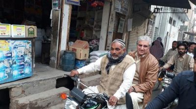 Shah Mehmood Qureshi takes a motorcycle ride through his constituency