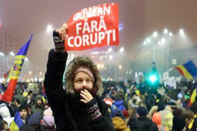 President backs protest-hit Romanian government to stay