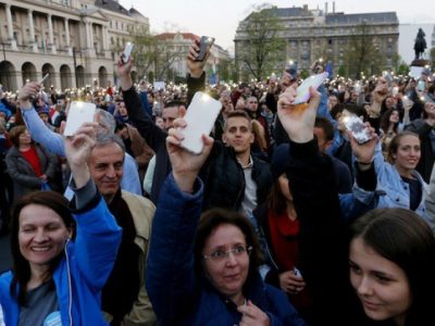 People light with their mobile phones as they protest against the bill that would undermine Central European University, a liberal graduate school of social sciences founded by U.S. financier George Soros in Budapest, Hungary, April 9, 2017. PHOTO: REUTERS