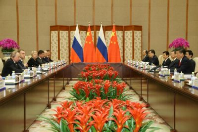 Chinese President Xi Jinping (R) speaks with Russian President Vladimir Putin (L) during a bilateral meeting at Diaoyutai State Guesthouse in Beijing, China, 14 May 2017. REUTERS/Wu Hong/Pool