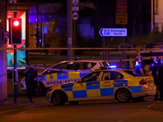 Police deploy at scene of explosion in Manchester, England, on May 23, 2017 at a concert. PHOTO: AFP