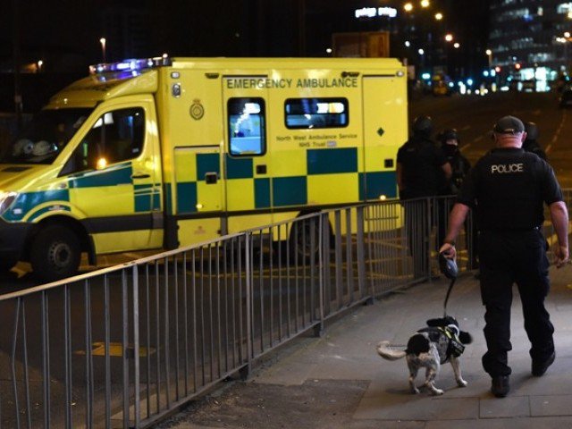 Emergency response vehicles arrive at the scene of a suspected terrorist attack during a pop concert by US star Ariana Grande in Manchester, northwest England on May 23, 2017. PHOTO: AFP