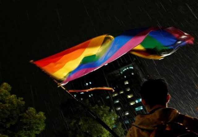 A supporter waves a rainbow flag during a rally after Taiwan's constitutional court ruled that same-sex couples have the right to legally marry, the first such ruling in Asia, in Taipei, Taiwan May 24, 2017. PHOTO: REUTERS