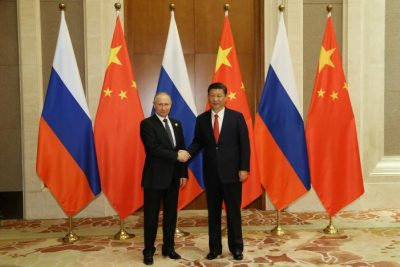 Russian President Vladimir Putin (L) shakes hands with Chinese President Xi Jinping ahead of a bilateral meeting at Diaoyutai State Guesthouse in Beijing, China, 14 May 2017. REUTERS/Wu Hong/Pool