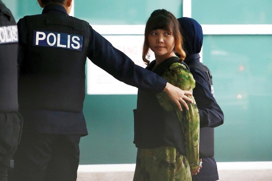 Vietnamese Doan Thi Huong who is on trial for the killing of Kim Jong Nam, the estranged half-brother of North Korea's leader, is escorted as she arrives at the Department of Chemistry in Petaling Jaya, near Kuala Lumpur, Malaysia. REUTERS