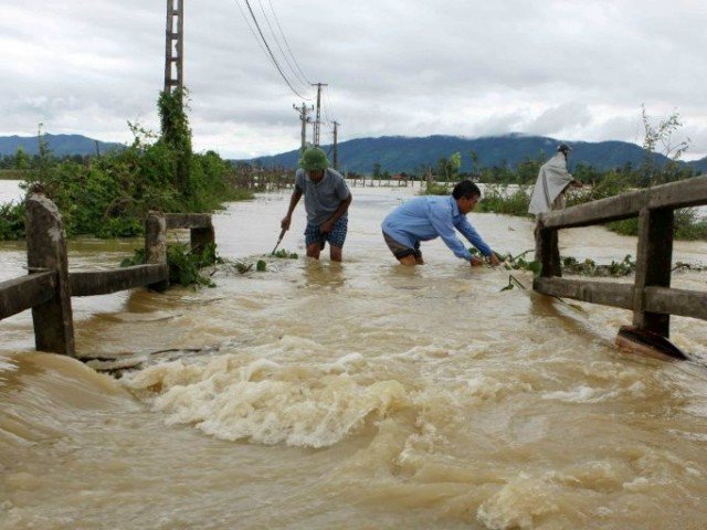 Floods and landslides in central and northern Vietnam have killed at least 37 people, with dozens more missing. PHOTO: AFP