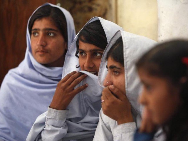 Students react while attending a lecture on preventive measures to take when sexual harassment occurs, during a class in Shadabad Girls Elementary School in Pir Mashaikh village in Johi, some 325km from Karachi February 12, 2014. PHOTO: REUTERS