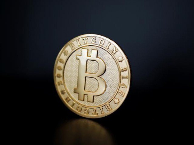 A Bitcoin (virtual currency) coin is seen in an illustration picture taken at La Maison du Bitcoin in Paris, France, June 23, 2017. PHOTO: REUTERS