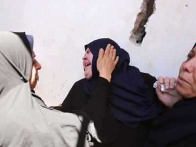 Palestinian relatives of 11-year-old Yasser Abu al-Naja, son of a Hamas military commander, grieve at his funeral in the Gaza Strip on June 30, 2018 a day after he was killed by Israeli fire during border clashes. PHOTO: AFP